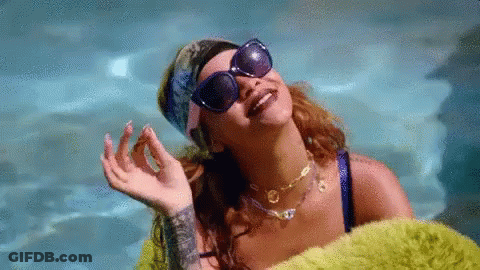 Woman In Sunglasses And Bandana Laying In Pool GIF