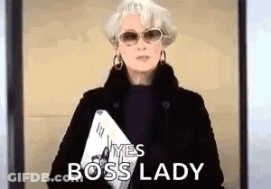 Woman In Sunglasses And Black Coat Holding Laptop And Paper GIF