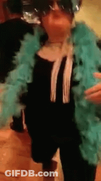 Woman In Sunglasses And Blue Boa Dancing GIF