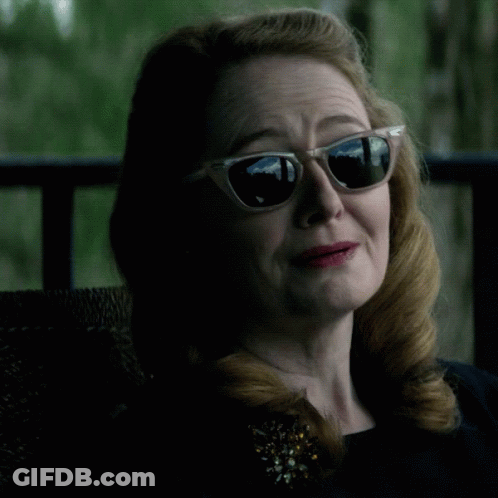 Woman In Sunglasses And Brooch With Word Praise GIF