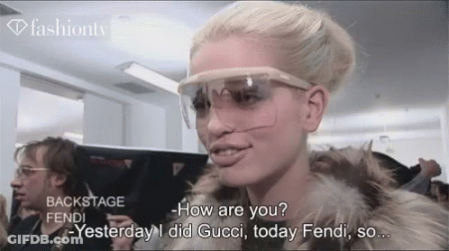 Woman In Sunglasses And Fur Coat Talking Gucci GIF