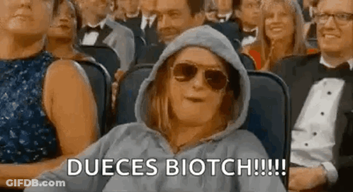 Woman In Sunglasses And Hoodie In Crowd GIF