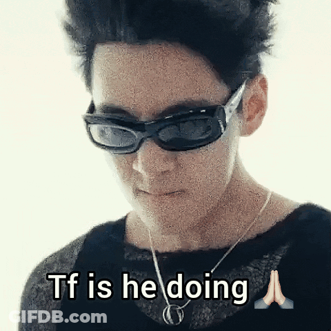 Woman In Sunglasses And Necklace Saying TF Is He Doing GIF