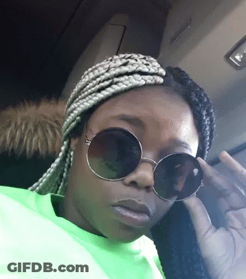 Woman In Sunglasses And Neon Green Shirt Giving Middle Finger GIF