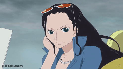 Woman In Sunglasses And Pearl Necklace Looking GIF