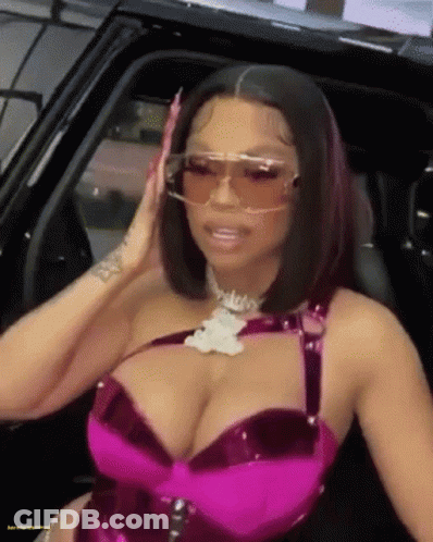 Woman In Sunglasses And Pink Bra Sitting In Car GIF