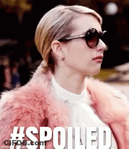 Woman In Sunglasses And Pink Fur Coat Saying Spoiled GIF
