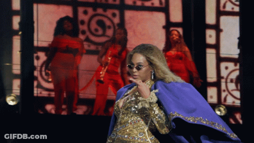 Woman In Sunglasses And Purple Cape GIF