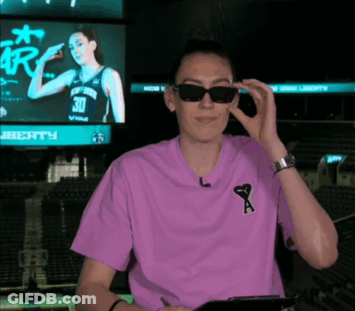 Woman In Sunglasses And Purple Shirt With Letter A GIF
