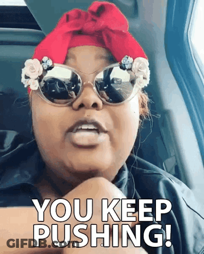 Woman In Sunglasses And Red Headband Saying You Keep Pushing GIF