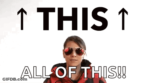 Woman In Sunglasses And Red Jacket Pointing Up Saying This 1 All Of This GIF