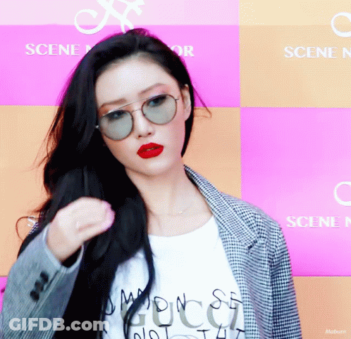 Woman In Sunglasses And Red Lipstick At Scene Sign GIF