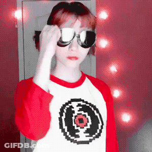 Woman In Sunglasses And Red Shirt GIF