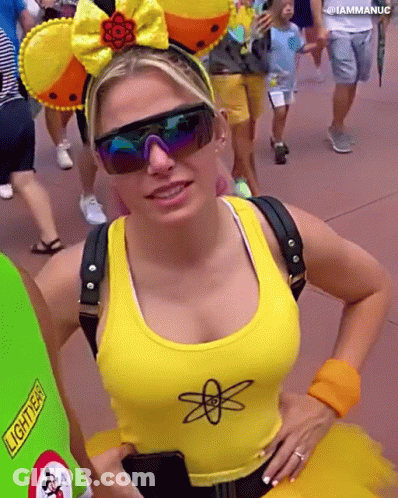 Woman In Sunglasses And Yellow Tank Top With Atom GIF
