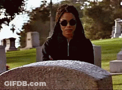 Woman In Sunglasses At Grave GIF