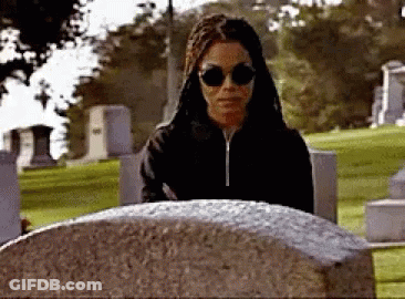 Woman In Sunglasses At Grave GIF