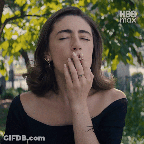 Woman In Sunglasses Covering Eyes GIF