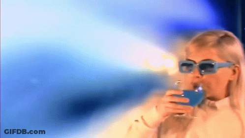 Woman In Sunglasses Drinking Blue Beverage GIF