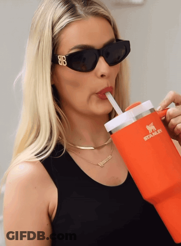 Woman In Sunglasses Drinking From Orange Tumbler GIF