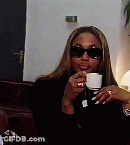 Woman In Sunglasses Drinking Tea GIF