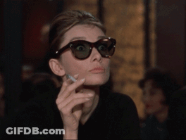 Woman In Sunglasses Holding Cigarette GIF
