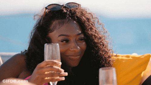 Woman In Sunglasses Holding Glass Of Wine GIF