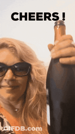 Woman In Sunglasses Holding Wine Bottle Cheers GIF