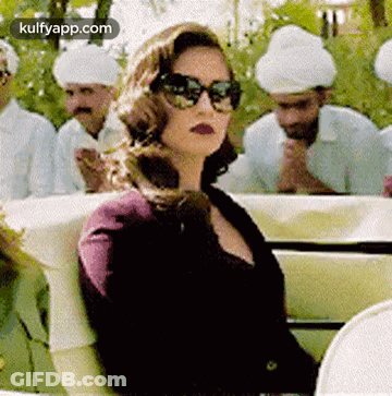 Woman In Sunglasses In Car With Men In Turbans GIF