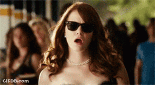 Woman In Sunglasses In Front Of Crowd GIF