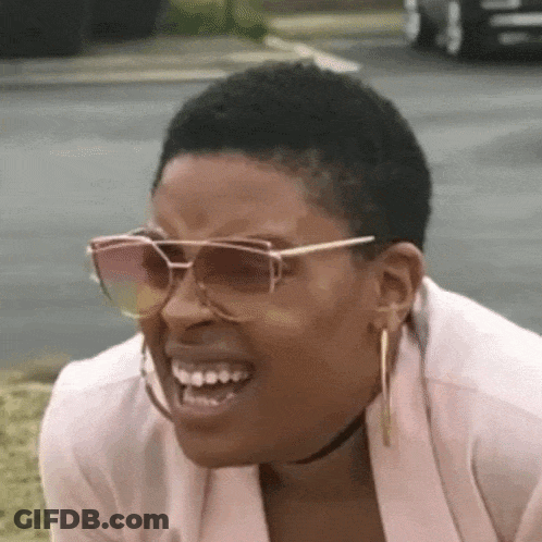 Woman In Sunglasses Making Funny Face On Grass GIF