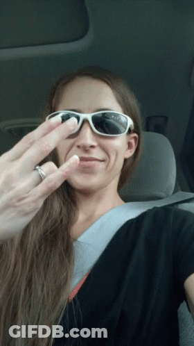 Woman In Sunglasses Making Funny Face With Wedding Ring GIF