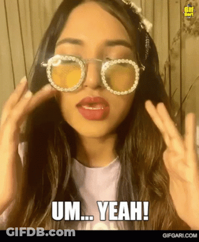 Woman In Sunglasses Making Peace Sign Saying Um Yeah GIF