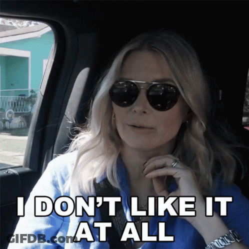 Woman In Sunglasses Saying I Don't Like It GIF
