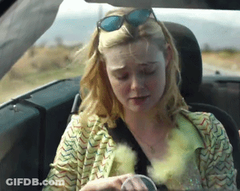 Woman In Sunglasses Sitting In Car GIF