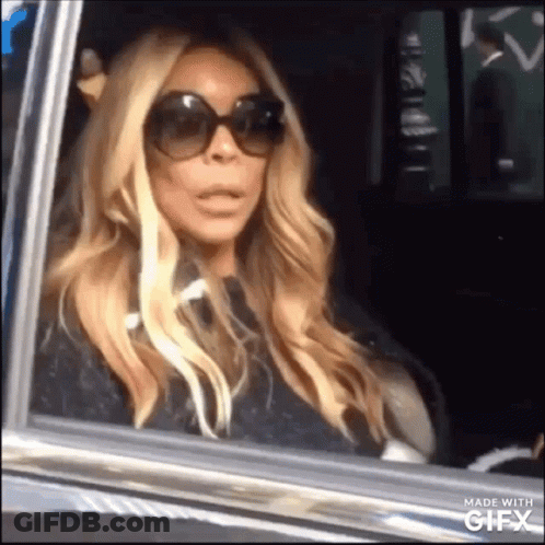 Woman In Sunglasses Sitting In Car GIF