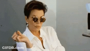 Woman In Sunglasses Sitting In Chair GIF