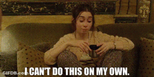 Woman In Sunglasses Sitting On Bed GIF