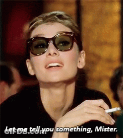 Woman In Sunglasses Smoking Saying Let Me Tell You Something Mister GIF