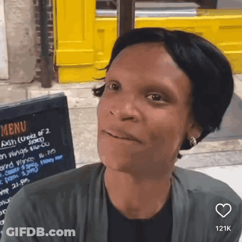 Woman In Sunglasses With Mouth Open In Car GIF
