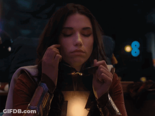 Woman In Superhero Costume And Sunglasses GIF