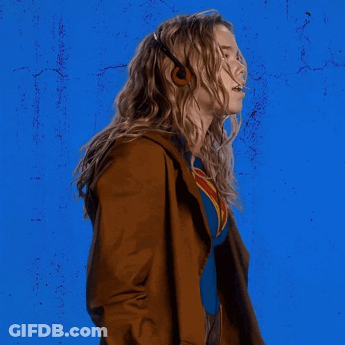 Woman In Superman Costume Blue Wall GIF