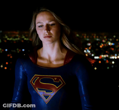 Woman In Superman Costume In City At Night GIF
