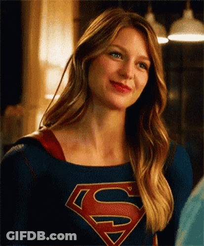 Woman In Superman Costume Smiling GIF