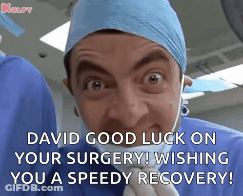 Woman In Surgical Mask And Blue Hat With Surgeons GIF