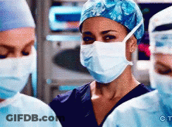 Woman In Surgical Mask Blue Hat Two Surgeons GIF