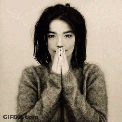 Woman In Sweater Covering Face With Hands GIF