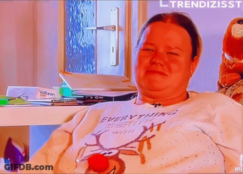 Woman In Sweater Saying Everything Is Better With A Red Nose GIF