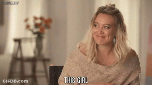 Woman In Sweater Smiling GIF