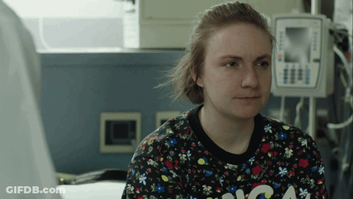 Woman In Sweater With Letter A At Medical Device GIF