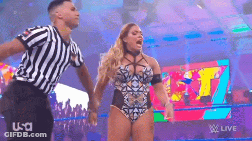 Woman In Swimsuit Standing Next To Referee GIF